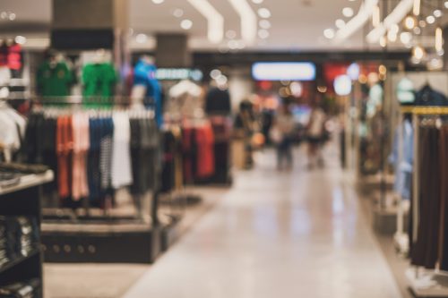 Blurred photo of the inside of a clothing retailer.