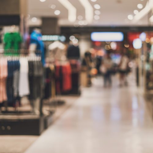 Blurred photo of the inside of a clothing retailer.