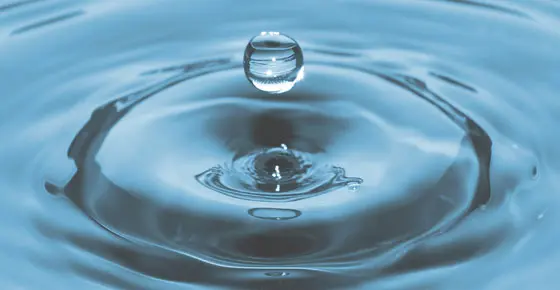 water dropping into puddle