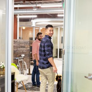 ken and kevin looking through door