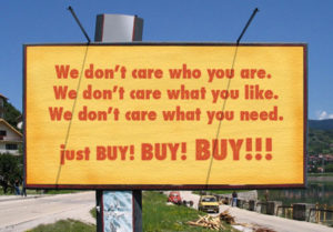 a billboard encouraging people to Buy Buy Buy!